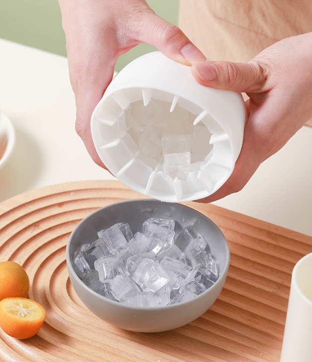 Pressing the flexible Mushroom Ice Mold to release small ice pieces