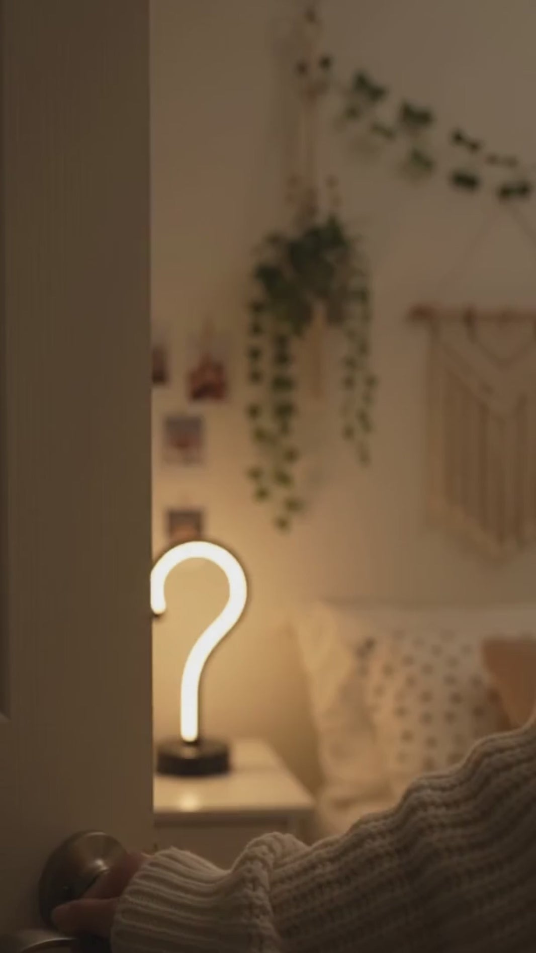 Question Mark Lamp glowing in a warm bedroom setting