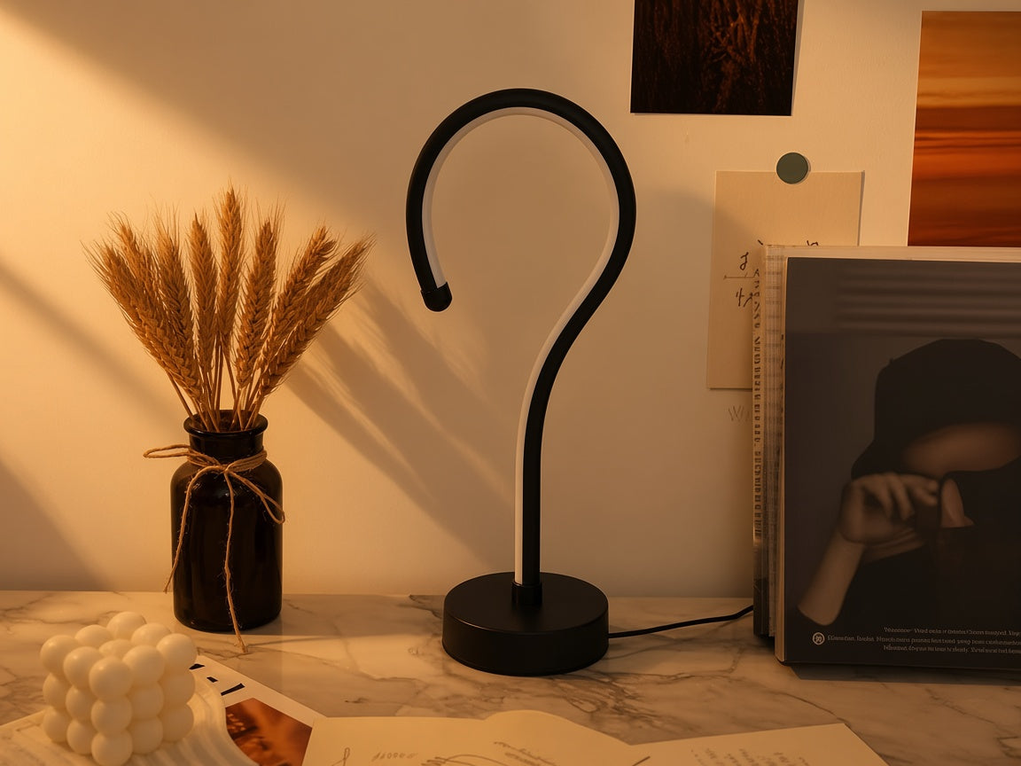 Question Mark Lamp unlit on a marble desk